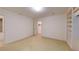 This carpeted bedroom has built-in shelving, a window and a closet space at 993 Castle Falls Dr. Ne Dr, Atlanta, GA 30329