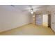 Open bedroom with neutral carpet, ceiling fan, built in shelves, and good natural light at 993 Castle Falls Dr. Ne Dr, Atlanta, GA 30329
