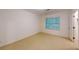 This carpeted bedroom has a window view and leads into an adjoining room or closet at 993 Castle Falls Dr. Ne Dr, Atlanta, GA 30329