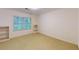 Bedroom featuring a large window and carpeted floor, ideal for relaxation at 993 Castle Falls Dr. Ne Dr, Atlanta, GA 30329