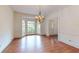 Elegant dining room featuring hardwood floors, large windows, and a chandelier at 993 Castle Falls Dr. Ne Dr, Atlanta, GA 30329