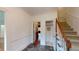 Welcoming foyer with stone flooring, staircase, and access to various rooms at 993 Castle Falls Dr. Ne Dr, Atlanta, GA 30329