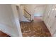 Inviting foyer with stone flooring, a staircase, and a view into the adjacent dining room at 993 Castle Falls Dr. Ne Dr, Atlanta, GA 30329