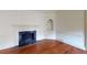 Cozy living room showcases hardwood floors, a fireplace, and built-in shelving at 993 Castle Falls Dr. Ne Dr, Atlanta, GA 30329