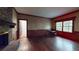 Spacious living room featuring hardwood floors, a fireplace, and large windows that provide lots of natural light at 993 Castle Falls Dr. Ne Dr, Atlanta, GA 30329
