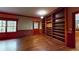 Open living space featuring hardwood floors, a wall of shelves, and lots of natural light at 993 Castle Falls Dr. Ne Dr, Atlanta, GA 30329