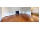 Bright living room featuring hardwood floors, a fireplace, and classic architectural details at 993 Castle Falls Dr. Ne Dr, Atlanta, GA 30329