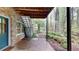Charming covered patio with brick accents and views of the lush, wooded backyard at 993 Castle Falls Dr. Ne Dr, Atlanta, GA 30329