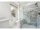 Stylish bathroom with a glass-enclosed shower featuring marble tiling and a sink at 108 Kirk Crossing Dr, Decatur, GA 30030