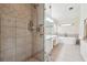 Modern bathroom featuring a glass-enclosed shower, tiled walls, and a standalone tub at 108 Kirk Crossing Dr, Decatur, GA 30030