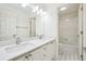 Bright bathroom with double sinks and a white-tiled shower/tub combination at 108 Kirk Crossing Dr, Decatur, GA 30030