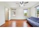 Bright room with hardwood floors, two windows, and a ceiling fan at 108 Kirk Crossing Dr, Decatur, GA 30030