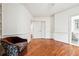 Bedroom highlighting hardwood floors, neutral paint, access to ensuite bathroom and closets at 108 Kirk Crossing Dr, Decatur, GA 30030