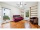 Bedroom with hardwood floors, natural light, built-in bookshelves, and calming color palette at 108 Kirk Crossing Dr, Decatur, GA 30030