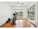 Sunlit exercise room features hardwood floors, large windows overlooking the yard, and a ceiling fan at 108 Kirk Crossing Dr, Decatur, GA 30030