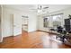 Open bedroom with hardwood floors, large windows, and an adjacent staircase at 108 Kirk Crossing Dr, Decatur, GA 30030