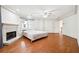 Bright bedroom with hardwood floors, a fireplace, and a ceiling fan at 108 Kirk Crossing Dr, Decatur, GA 30030