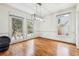 Bright dining room features hardwood floors, large windows, and modern chandelier at 108 Kirk Crossing Dr, Decatur, GA 30030
