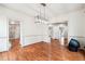 Open dining room showcases hardwood floors and an elegant modern light fixture at 108 Kirk Crossing Dr, Decatur, GA 30030