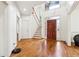 Welcoming foyer with hardwood floors, staircase, and natural light streaming through decorative glass door at 108 Kirk Crossing Dr, Decatur, GA 30030
