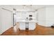 Bright kitchen showcasing a large island, stainless steel appliances, and hardwood floors, and white cabinetry at 108 Kirk Crossing Dr, Decatur, GA 30030