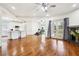 Open-concept living room with hardwood floors, a fireplace, and views of the kitchen at 108 Kirk Crossing Dr, Decatur, GA 30030