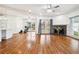 Inviting living room with hardwood floors, a fireplace, and access to the backyard at 108 Kirk Crossing Dr, Decatur, GA 30030