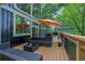 Outdoor space featuring a lounge area, a black metal railing, and floor-to-ceiling windows at 132 Lakeshore Dr, Roswell, GA 30075