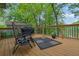 Outdoor relaxation on the back deck with lounge chairs and a view of the serene lake at 132 Lakeshore Dr, Roswell, GA 30075