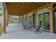 The lower-level patio with outdoor seating offers relaxation and seamless access to the home's natural surroundings at 132 Lakeshore Dr, Roswell, GA 30075