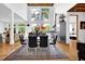 Open dining and kitchen area with large windows, stainless steel appliances, and modern furnishings, ideal for entertaining at 132 Lakeshore Dr, Roswell, GA 30075