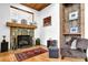Cozy living room features a stone fireplace, wooden shelves, and a comfortable seating area, perfect for relaxation at 132 Lakeshore Dr, Roswell, GA 30075