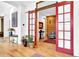 Stylish living room showcasing a red barn door, hardwood floors, and chic decor for a welcoming atmosphere at 132 Lakeshore Dr, Roswell, GA 30075