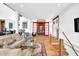 Inviting living room featuring hardwood floors, stylish furnishings, and a striking red barn door creating a cozy atmosphere at 132 Lakeshore Dr, Roswell, GA 30075
