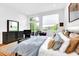 Bright main bedroom with a deck, minimalist furnishings, and scenic views, creating a peaceful atmosphere at 132 Lakeshore Dr, Roswell, GA 30075