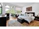 Serene main bedroom with large windows, deck access, and modern decor, providing a relaxing retreat at 132 Lakeshore Dr, Roswell, GA 30075