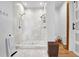 Elegant walk-in shower with dual shower heads, marble tiling, and a pebble floor, offering a spa-like experience at 132 Lakeshore Dr, Roswell, GA 30075