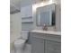 Bathroom features modern vanity, white tiled shower/tub and tiled floors at 207 Bridge Se Ln, Smyrna, GA 30082