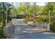 View of the community bridge lined with trees and decorative street lamps at 207 Bridge Se Ln, Smyrna, GA 30082