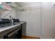Laundry room features sleek appliances, wire shelving and neutral walls at 207 Bridge Se Ln, Smyrna, GA 30082