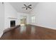 Bright living room featuring a fireplace, beautiful flooring, and a sliding glass door at 207 Bridge Se Ln, Smyrna, GA 30082
