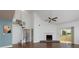 Bright living room featuring a spiral staircase, high ceilings, fireplace, and sliding glass door at 207 Bridge Se Ln, Smyrna, GA 30082