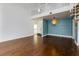 Spacious living room with beautiful wood floors, spiral staircase, and high ceilings at 207 Bridge Se Ln, Smyrna, GA 30082
