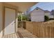 Outdoor porch with wood flooring, a white door, and surrounding greenery at 207 Bridge Se Ln, Smyrna, GA 30082