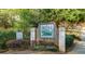 Community entrance sign for The Bridge at Millpond, surrounded by lush greenery at 207 Bridge Se Ln, Smyrna, GA 30082