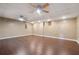Spacious basement with ceiling fan, hardwood floors, and recessed lighting at 21 Enclave Walk, Powder Springs, GA 30127
