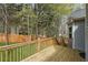 Spacious wooden deck provides a serene outdoor space overlooking the backyard at 21 Enclave Walk, Powder Springs, GA 30127