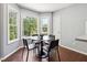 Charming dining area with abundant natural light and hardwood flooring at 21 Enclave Walk, Powder Springs, GA 30127