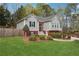 Charming two-story home with well-manicured lawn and mature landscaping at 21 Enclave Walk, Powder Springs, GA 30127