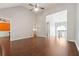 Open floor plan featuring vaulted ceiling and hardwood floors throughout the living areas at 21 Enclave Walk, Powder Springs, GA 30127